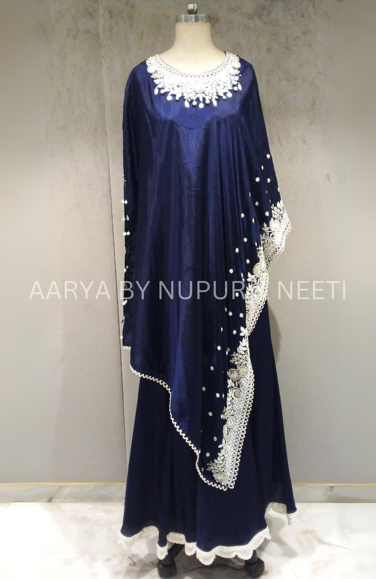 Pure Silk Bandhej Cape with Hand Embroidered Border and Neckline with Flair Palazzos